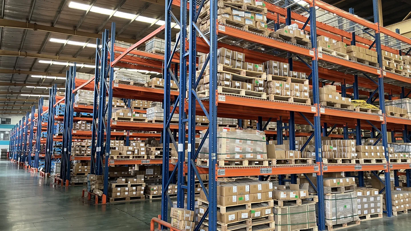 Organized warehouse with stocked components and packaged inventory
